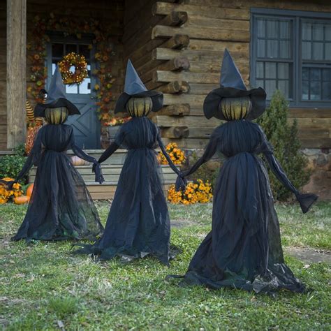 Get spooky with a witch figurine and menacing stakes for your Halloween decor